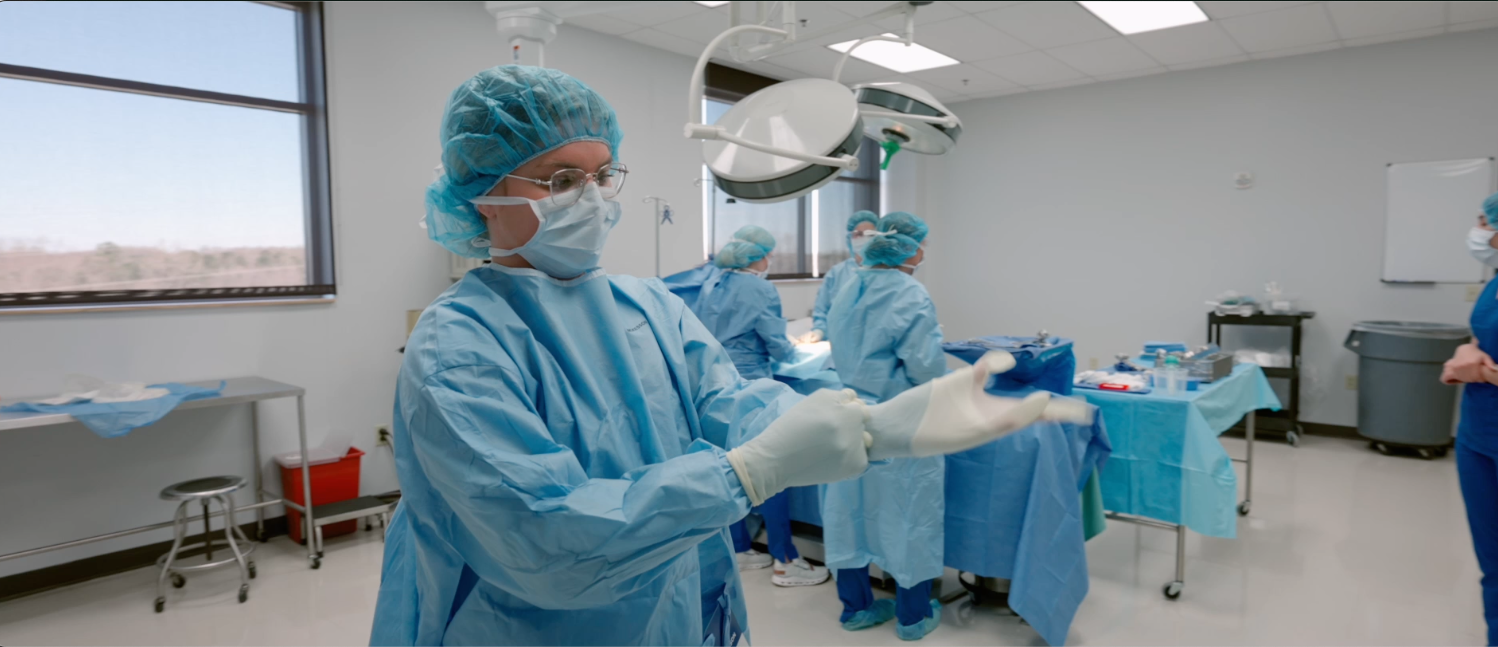 Surgical tech students prepare for class fully decked out in surgical clothing.