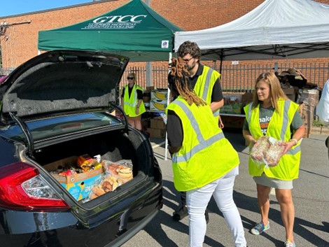 GTCC staff members work at a 2023 Fresh Mobile Market on the GTCC High Point Campus. 